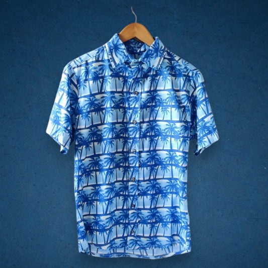Camisa con estampado azul de palmeras en sunset 100% algodón
